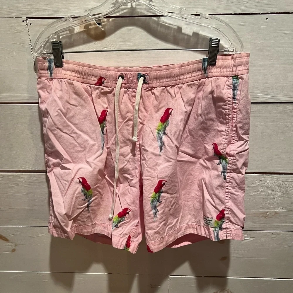 Modern Amusement men’s pink parrot print swim trunks size medium, GUC, lined.